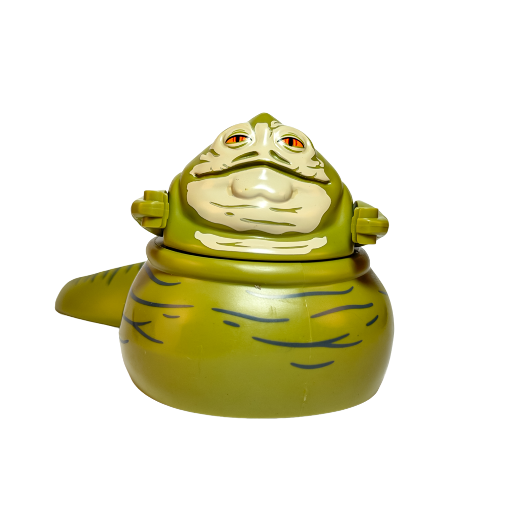 Figura de colección de gran escala de Jabba el Hutt de Star Wars sobre un fondo negro puro. Es una criatura alienígena grande y verde con forma de babosa. Tiene ojos naranjas brillantes, boca ancha y brazos pequeños articulados. El cuerpo presenta pliegues y marcas oscuras que simulan una piel rugosa.