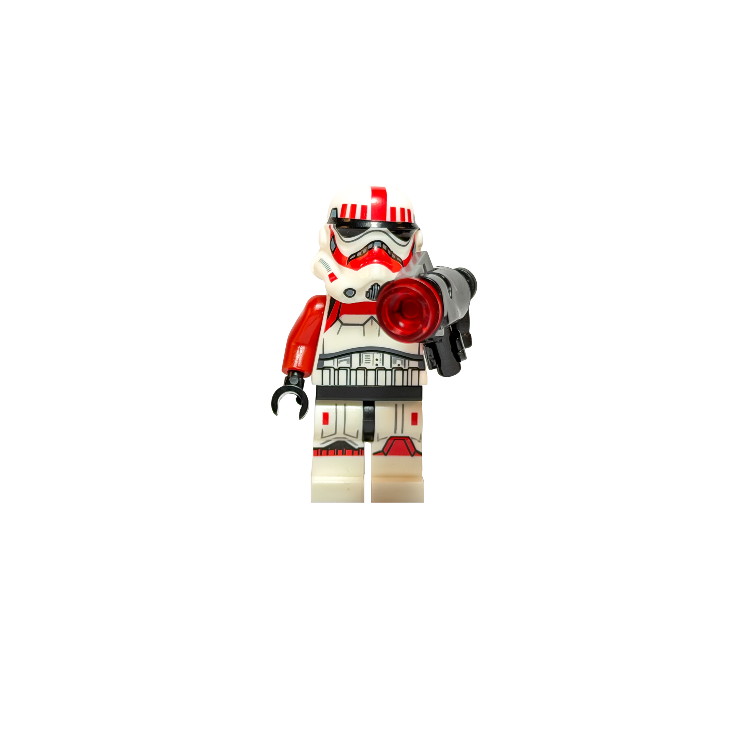 Minifigura de colección de un Shock Trooper Imperial de Star Wars sobre un fondo negro puro. Viste una armadura de Stormtrooper blanca con marcas decorativas de color rojo vibrante en el casco y los hombros. Sostiene hacia adelante un arma disparadora negra con una pieza circular roja brillante en la punta. La iluminación frontal resalta los detalles del casco.